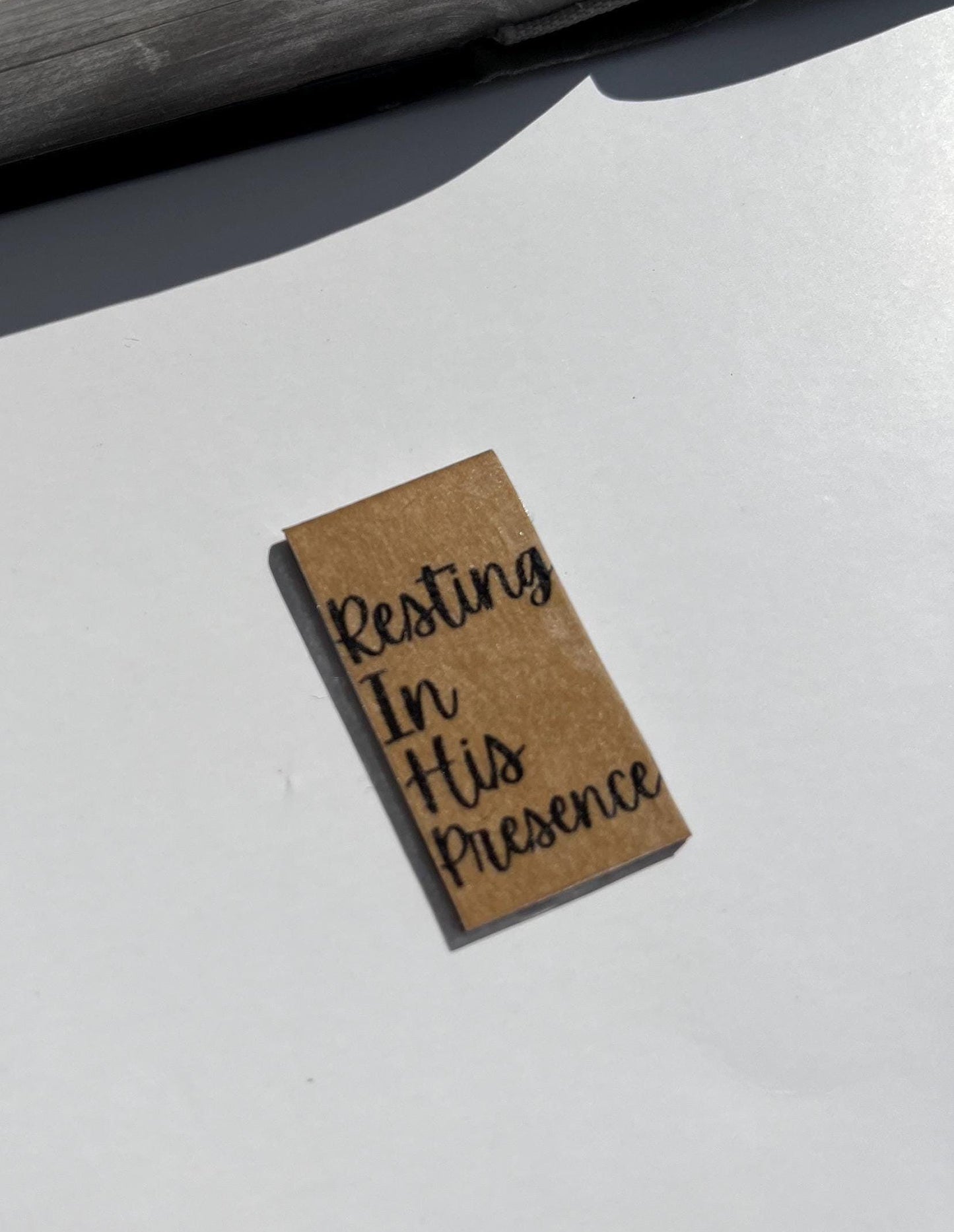 Kraft paper brown magnetic Bible bookmark that reads Resting in His Presence